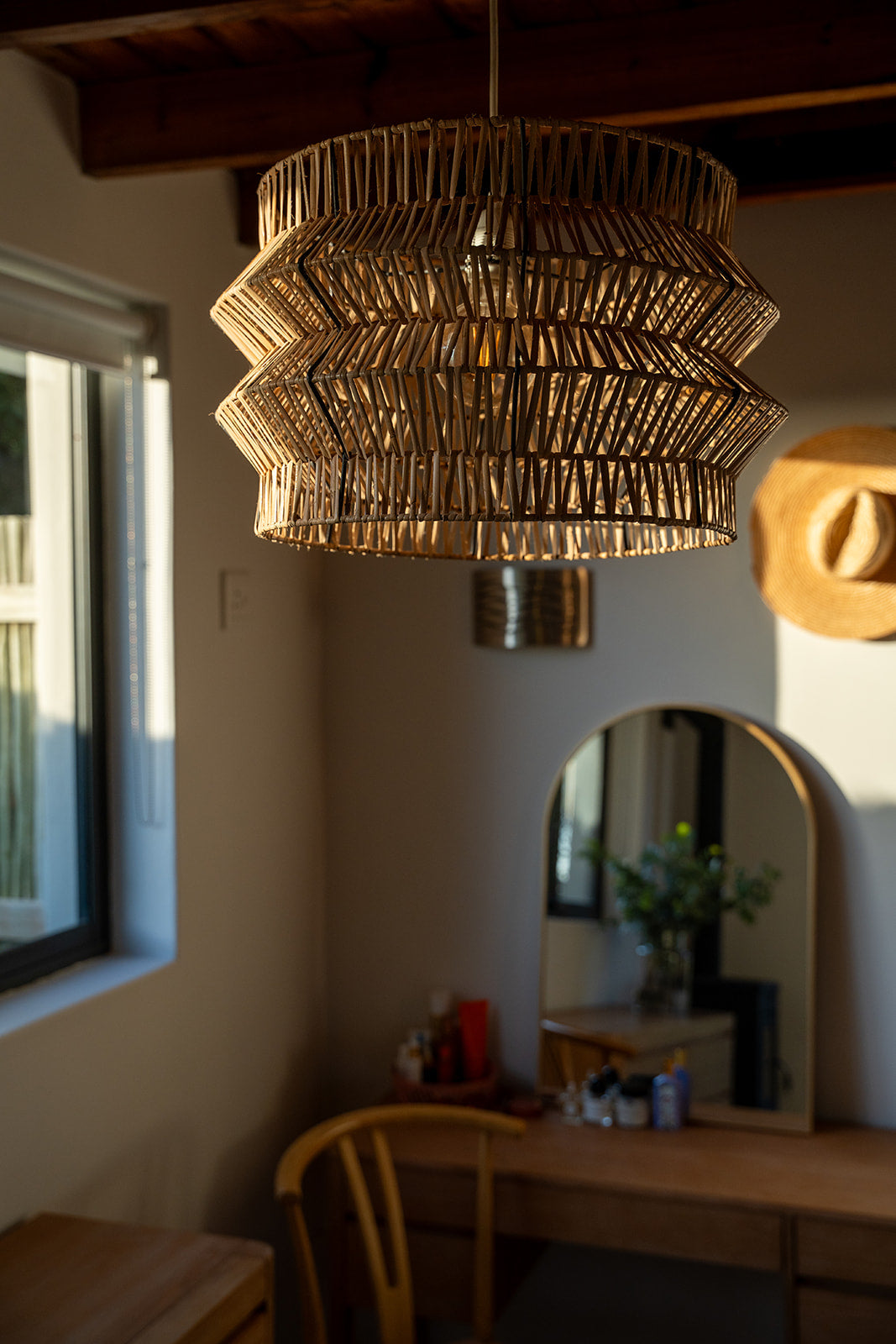 The Safari pendant on display in a rustic, safari themed bedroom