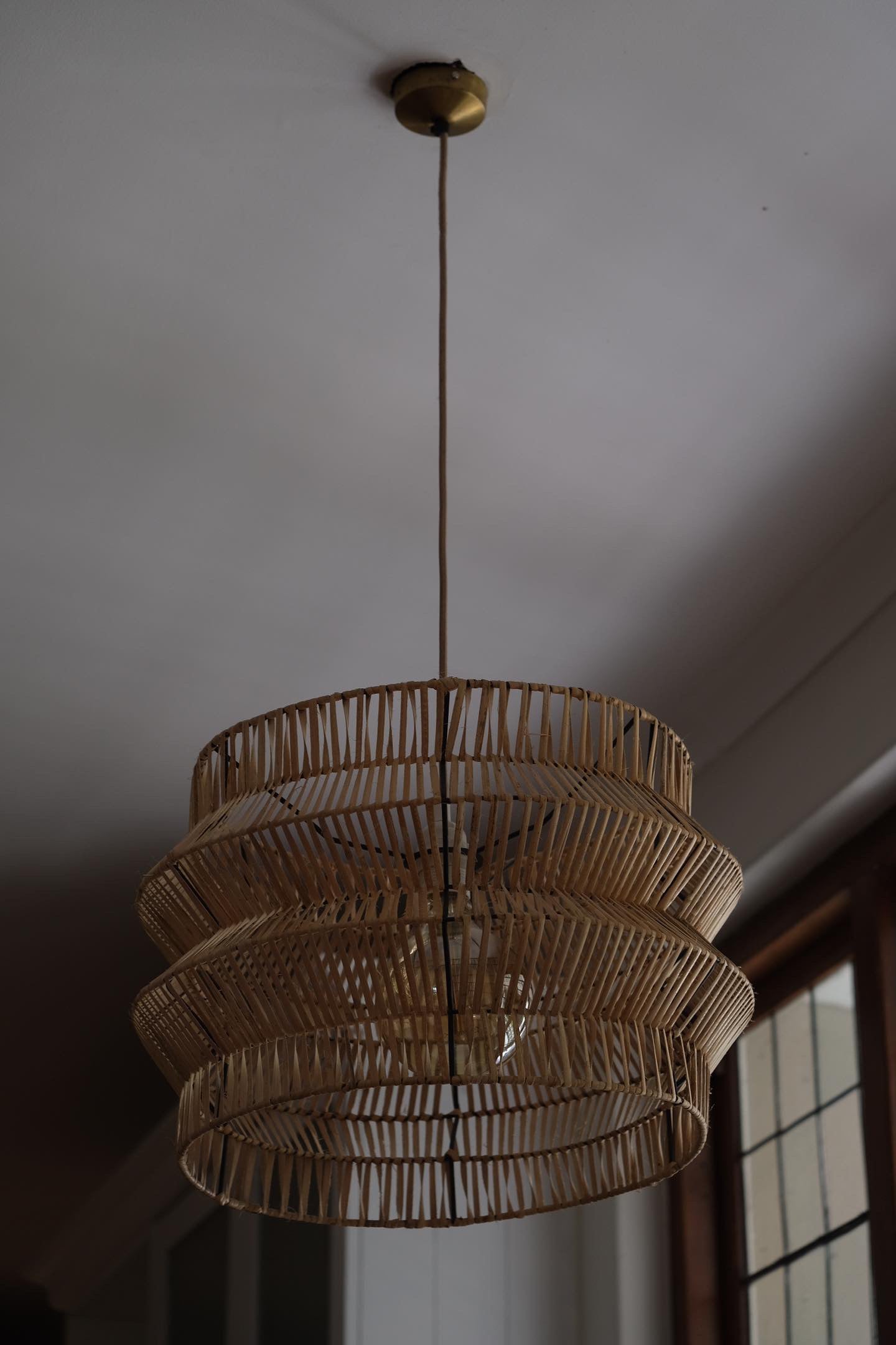 The Safari pendant on display in a rustic, safari themed bedroom