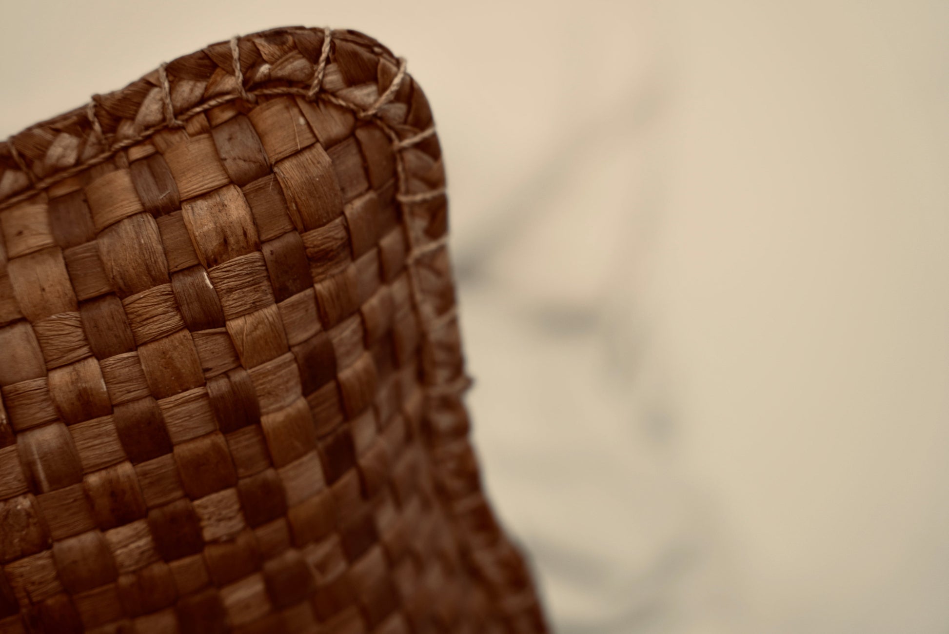 The crispy woven cushion photographed up close to showcase the intricate weaving pattern