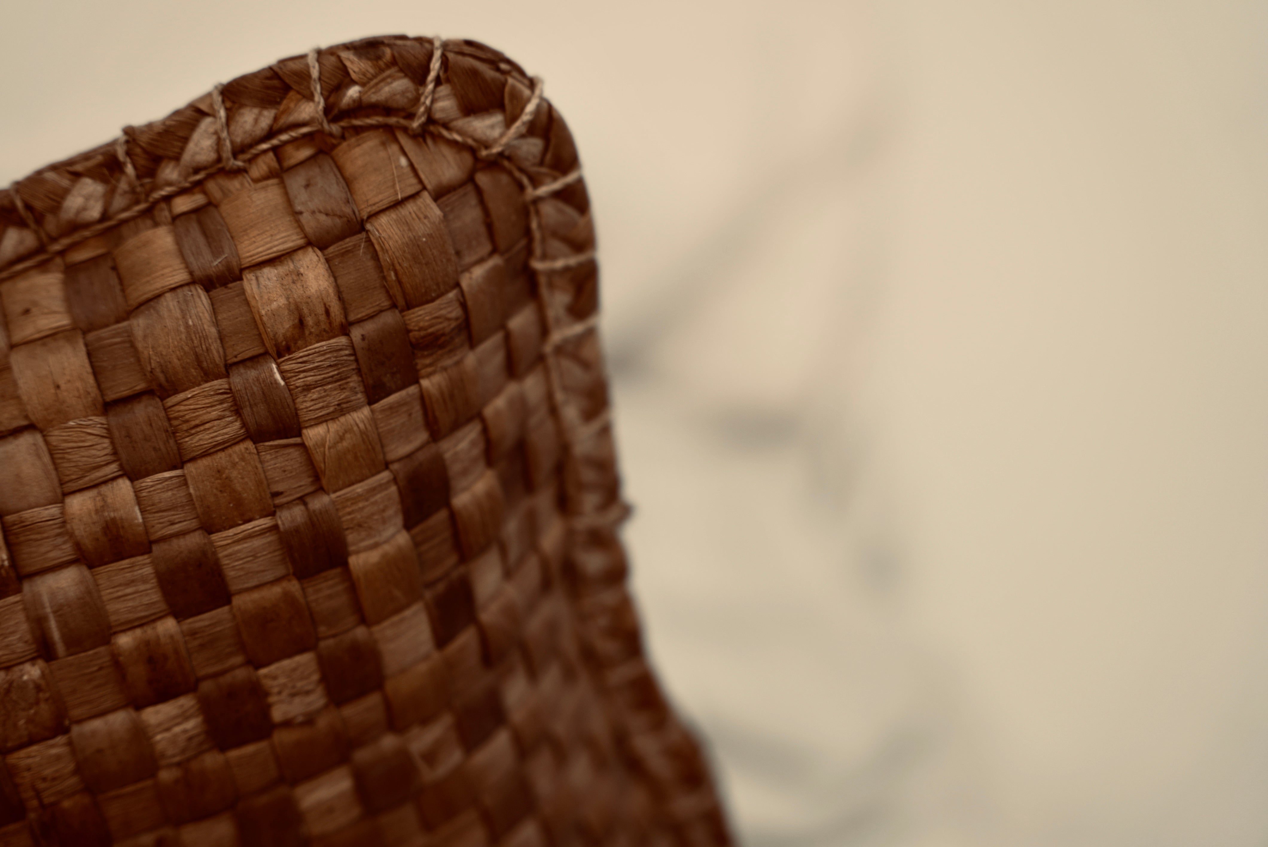 The crispy woven cushion photographed up close to showcase the intricate weaving pattern