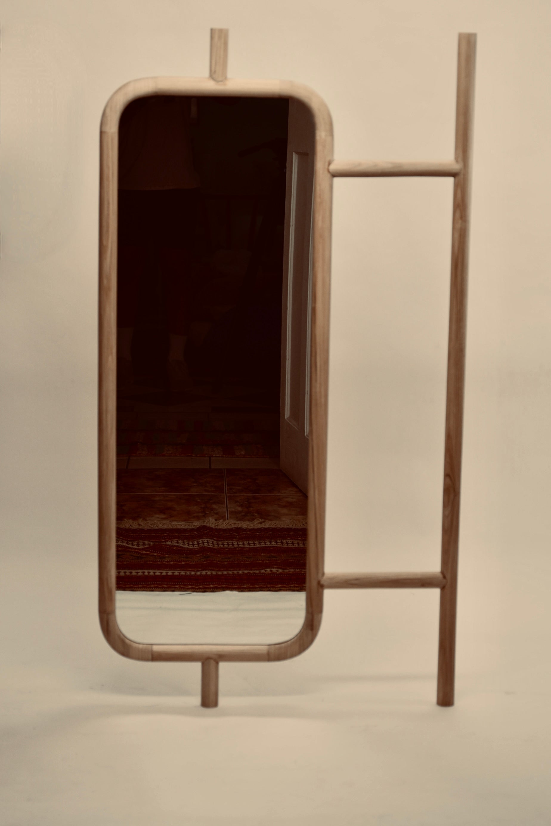The Muji mirror photographed against a neutral background