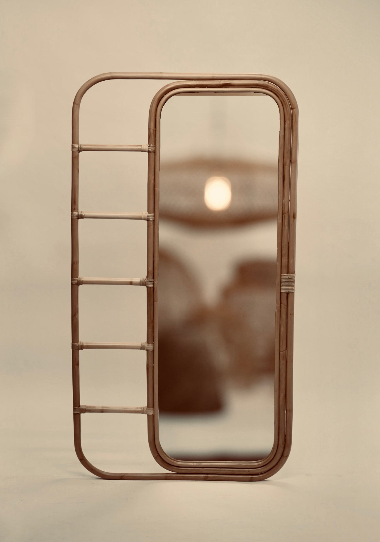 The Ibu mirror photographed against a neutral background