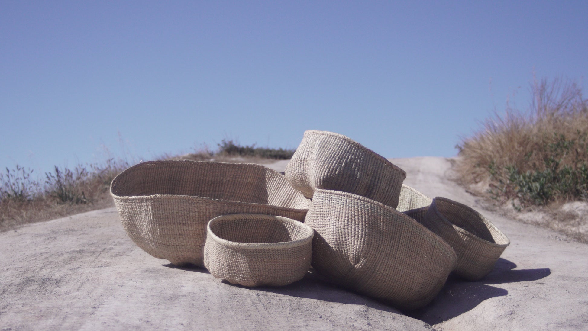A bunch of Ilala wonky baskets photgraphed from the side